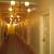 Second floor corridor after restoration with new wood floors, original paint colors and replica historic lighting